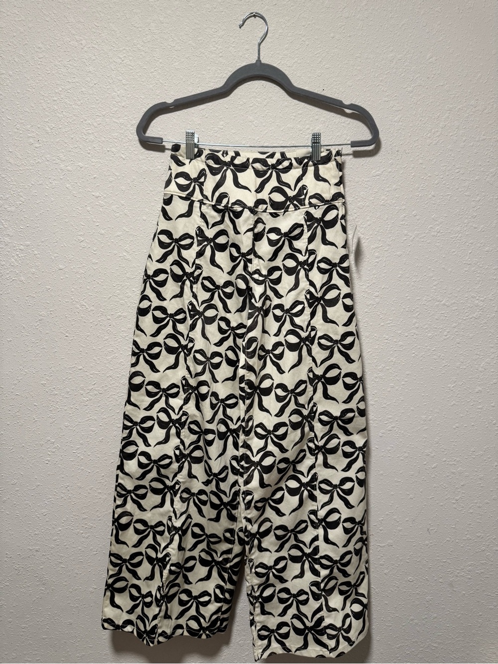 We The Free Wide Leg Pants in Cream with Black Bow Print
